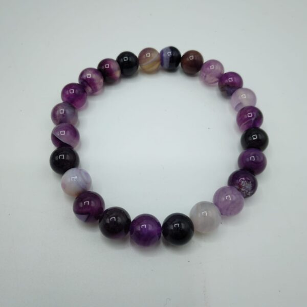 BRACCIALE CON PERLE IN PIETRA - immagine 2